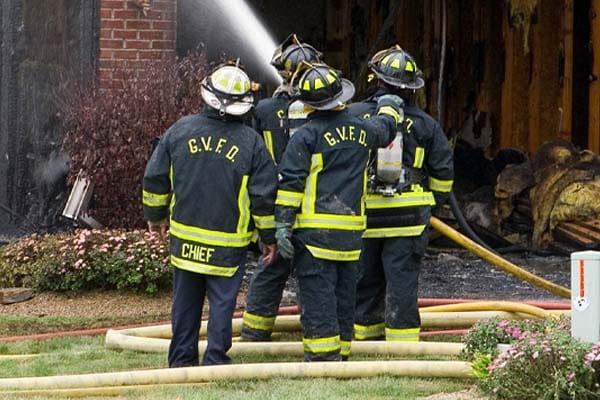 volunteer firefighters at a fire scene